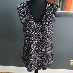 Vince Camuto black with white dot crepe front, solid stretch knit back top. Med
